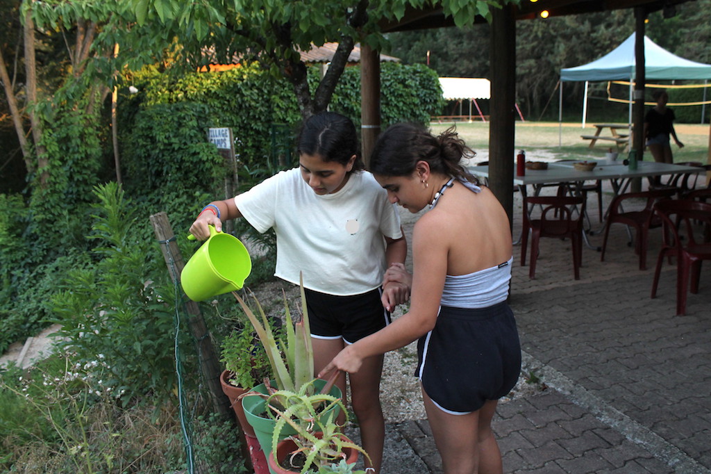 Village Camps International Summer Camp Ard&egrave;che, France 2019-07-26 https://www.villagecamps.com/journals_admin/images/2154-4730-Watering_plants.jpg